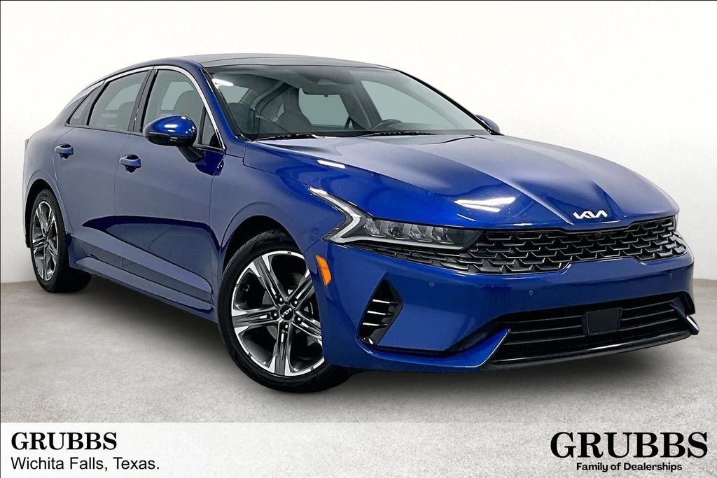2024 Kia K5 EX in Sapphire Blue — front three-quarter view