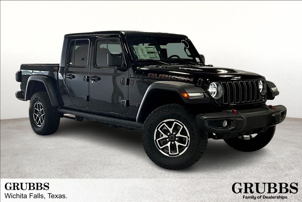 2025 Jeep Gladiator GLADIATOR RUBICON 4X4 in Black Clear-Coat Exterior Paint — front three-quarter view