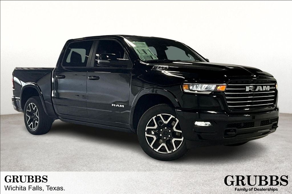 2025 RAM Ram 1500 RAM 1500 LARAMIE CREW CAB 4X4 5'7' BOX in Diamond Black Crystal Pearl-Coat Exterior Paint — front three-quarter view