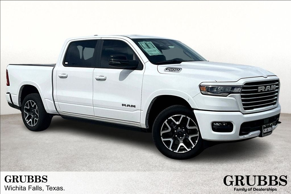 2025 RAM Ram 1500 RAM 1500 LARAMIE CREW CAB 4X4 5'7' BOX in Bright White Clear-Coat Exterior Paint — front three-quarter view