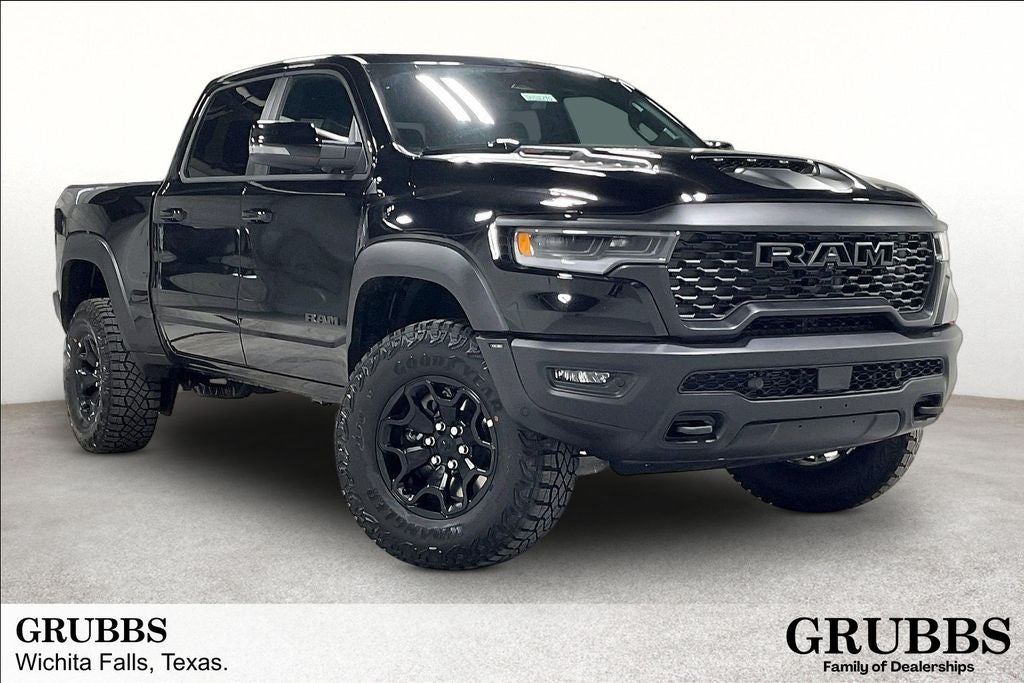 2026 RAM Ram 1500 RAM 1500 RHO CREW CAB 4X4 5'7' BOX in Diamond Black Crystal Pearl-Coat Exterior Paint — front three-quarter view