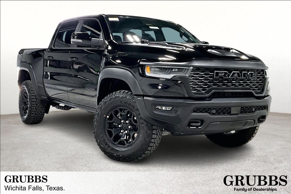 2026 RAM Ram 1500 RAM 1500 RHO CREW CAB 4X4 5'7' BOX in Diamond Black Crystal Pearl-Coat Exterior Paint — front three-quarter view
