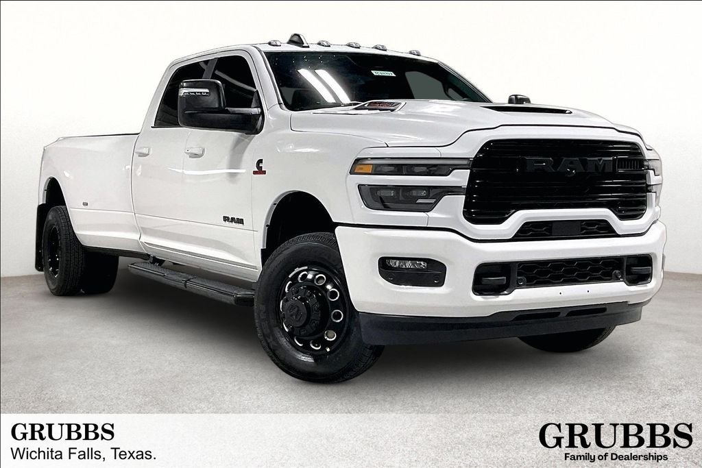 2026 RAM Ram 3500 RAM 3500 LARAMIE CREW CAB 4X4 8' BOX in Bright White Clear-Coat Exterior Paint — front three-quarter view