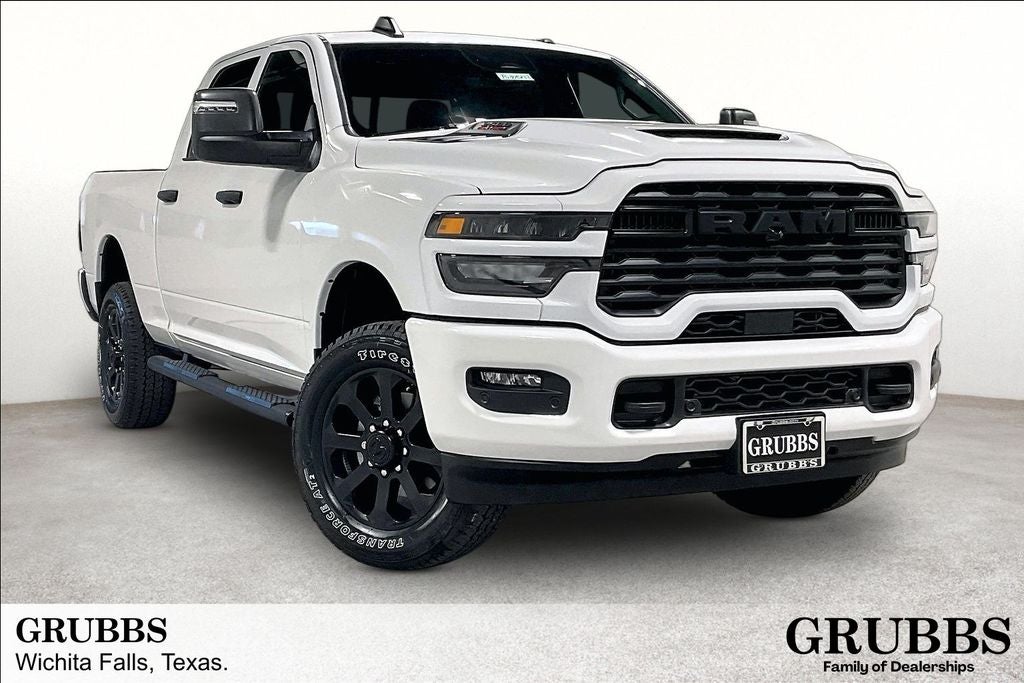 2026 RAM Ram 2500 RAM 2500 BLACK EXPRESS CREW CAB 4X4 6'4' BOX in Bright White Clear-Coat Exterior Paint — front three-quarter view