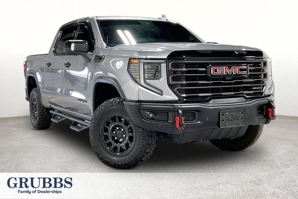 2024 GMC Sierra 1500 AT4X in Sterling Metallic — front three-quarter view