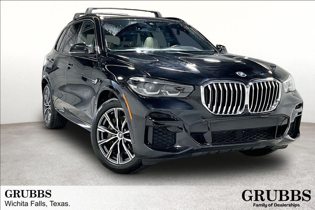 2022 BMW X5 xDrive45e in Black Sapphire Metallic — front three-quarter view