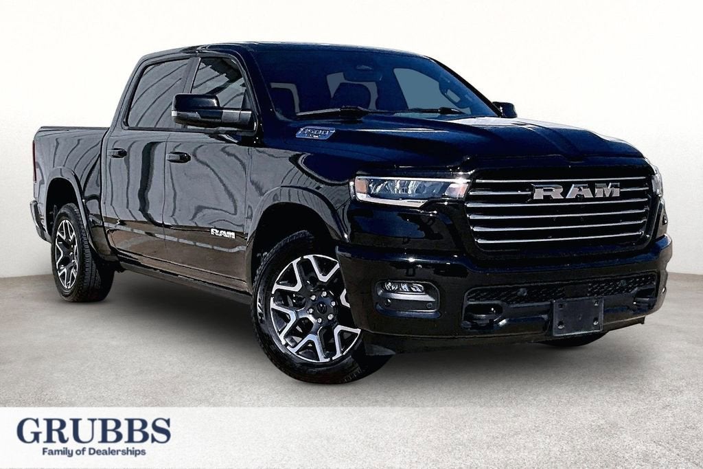 2025 RAM 1500 Laramie Crew Cab 4x4 5'7" Box in Black — front three-quarter view